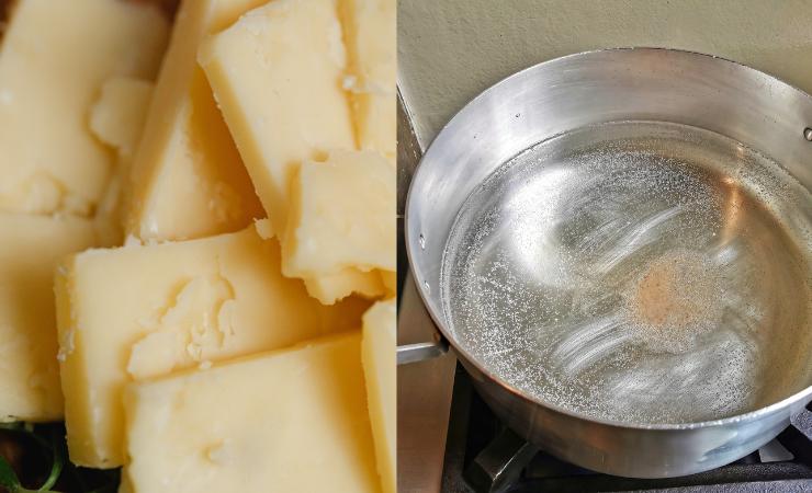 fontina a pezzi e pentola con acqua sul fuoco