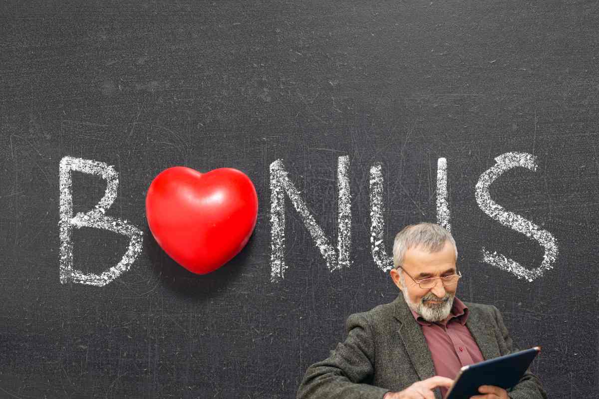 scritta bonus con cuoricino e uomo sorridente con tablet